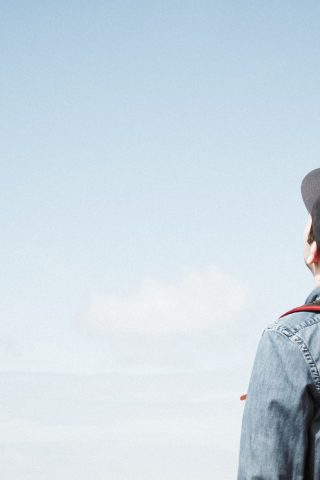 boy in baseball cap with backpack - sustainability and education