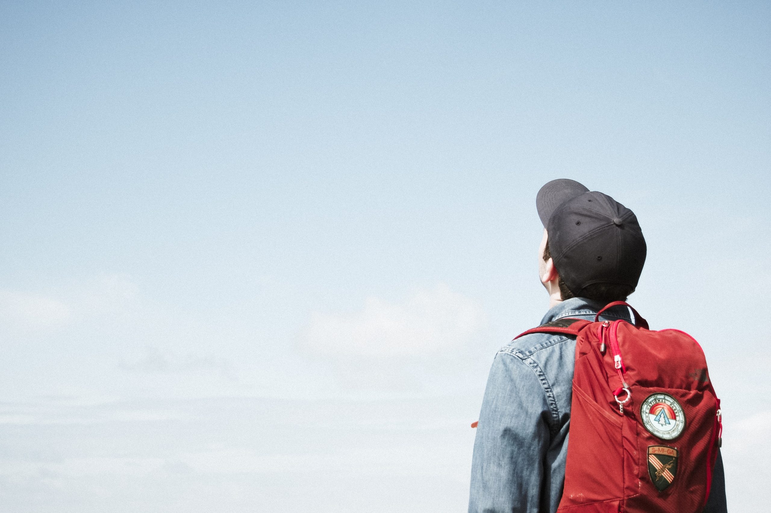 boy in baseball cap with backpack - sustainability and education