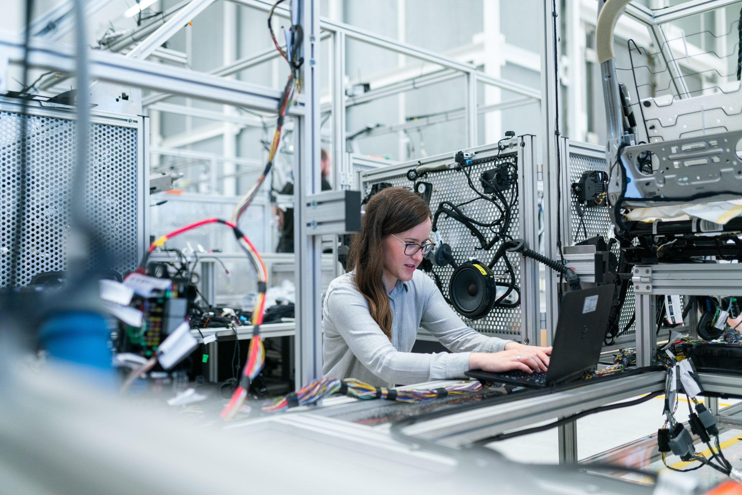 Woman in Machinery Workspace - Deep Tech Manufacturing