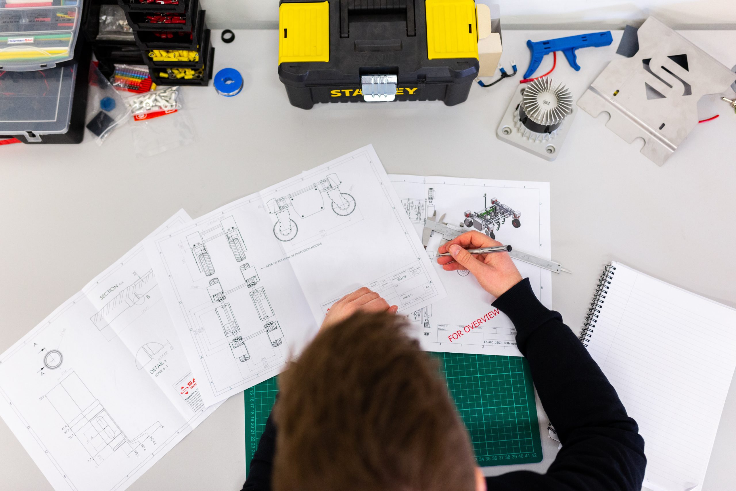 overhead shot of student working - right to repair education