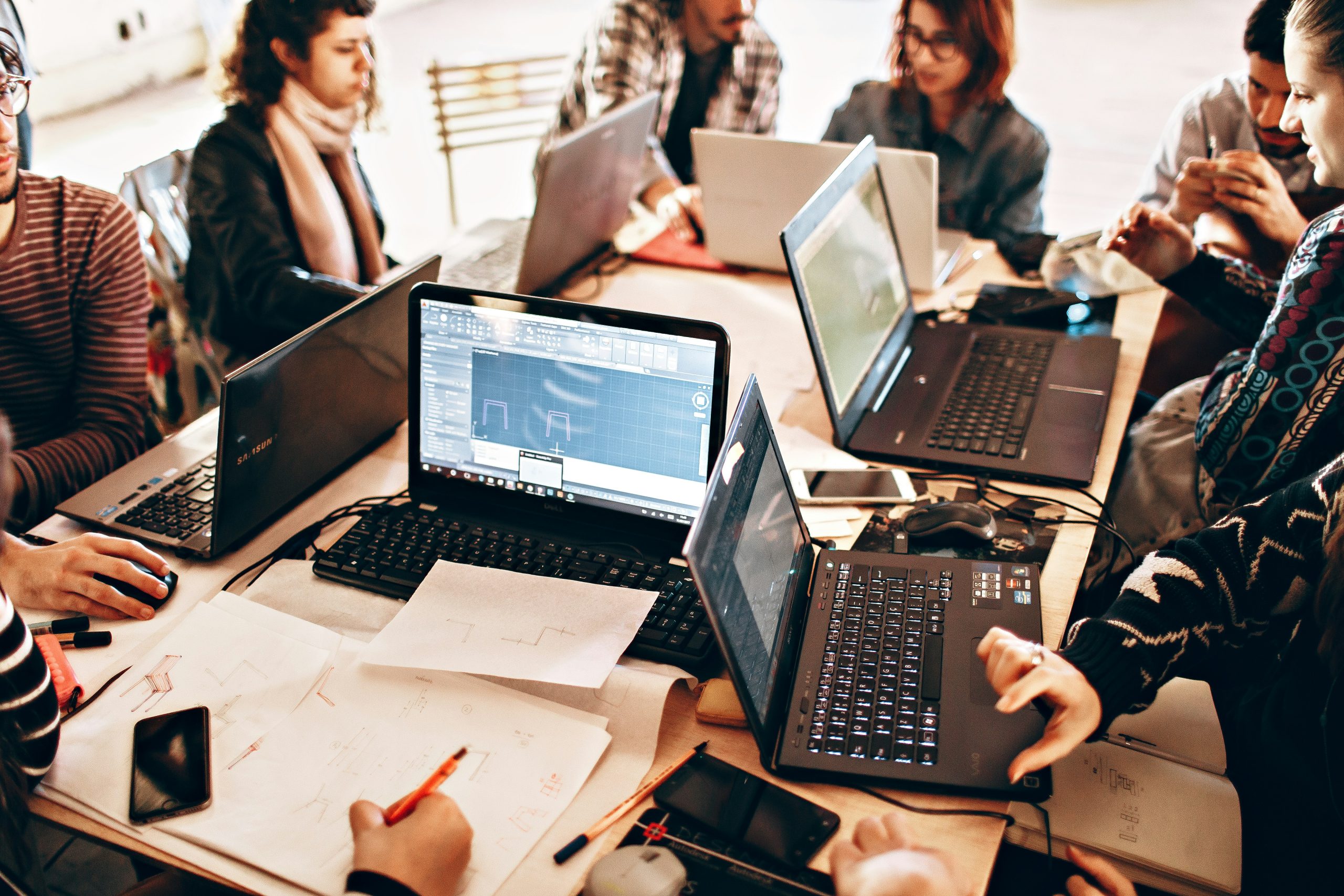 enterprise ITAD - image of full desk of computers and employees