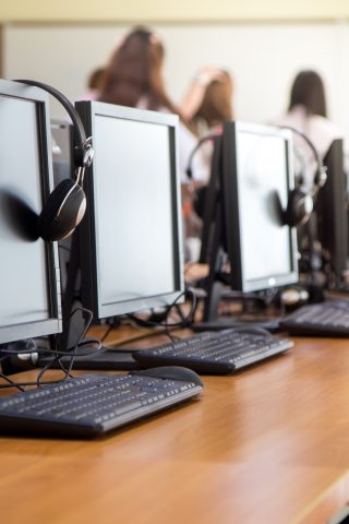 row of computers - Sustainable Campus Device Recycling