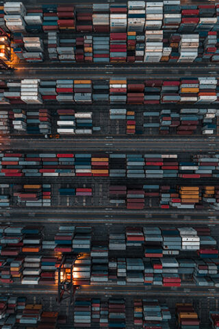 overhead view of multi-colored shipping containers - Sustainable Logistics Practice